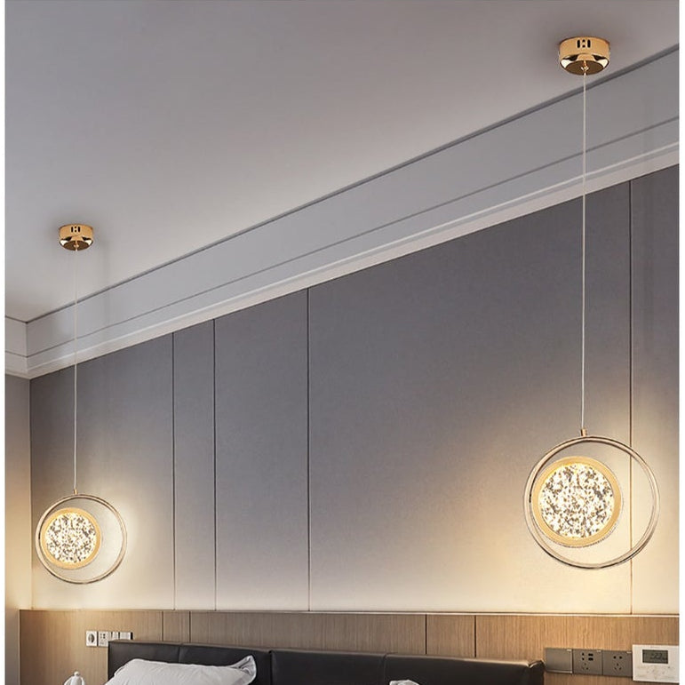 Gemelli Collections LED double ring pendant light with rose gold halo design, integrated warm white LED illumination, and modern ceiling-mounted fixture for luxury contemporary interiors.