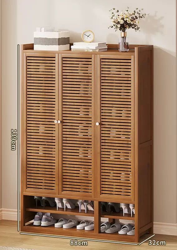 10-tier bamboo shoe cabinet with 3 slatted doors and open bottom shelves for entryway storage

Upgrade your home organization with this stylish and functional bamboo shoe storage cabinet — perfect for organized living.