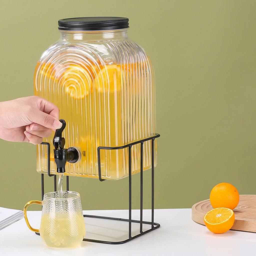 5.7-litre glass juice dispenser with metallic stand and lid for serving beverages at parties, buffets and home gatherings, available in Nairobi, Kenya.