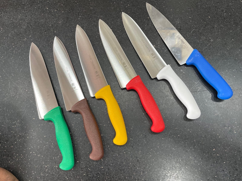 Colour-coded commercial kitchen knives in different sizes for meat, poultry, fish, vegetables, dairy and allergen-free food preparation.
