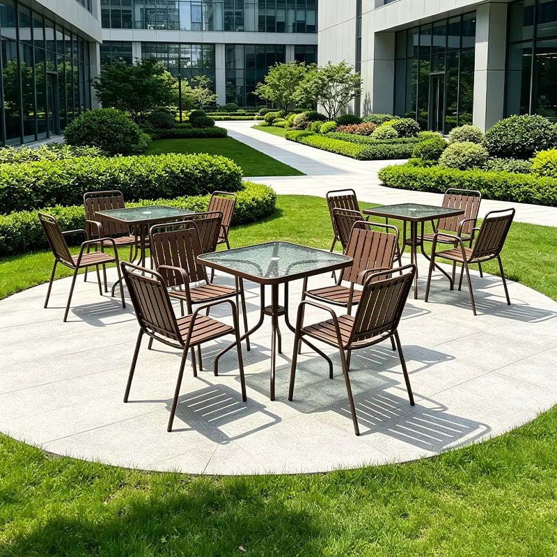 Outdoor square patio dining table with textured tempered glass top and brown metal frame, 80cm wide and 70cm high.Outdoor Furniture Nairobi Kenya