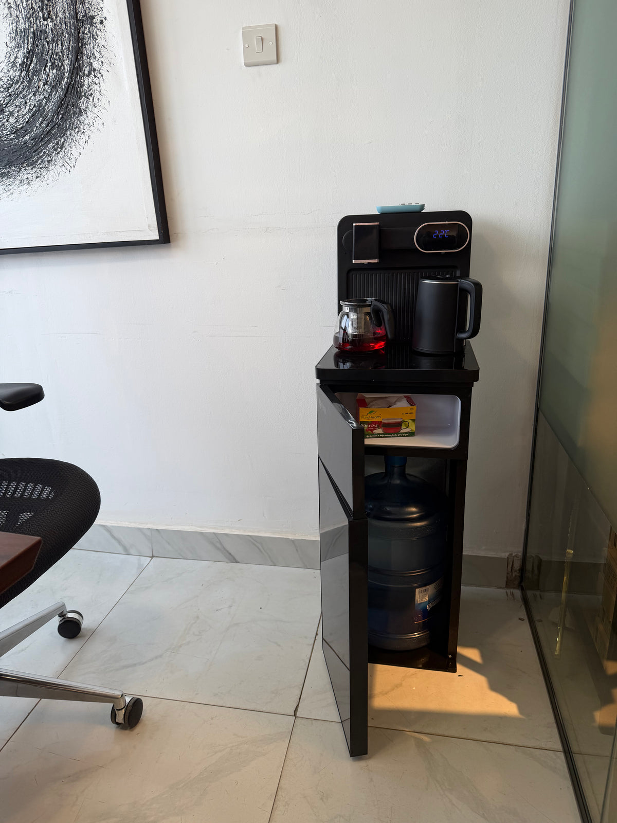 Bottom load hot and cold water dispenser with remote control, office and home hydration.