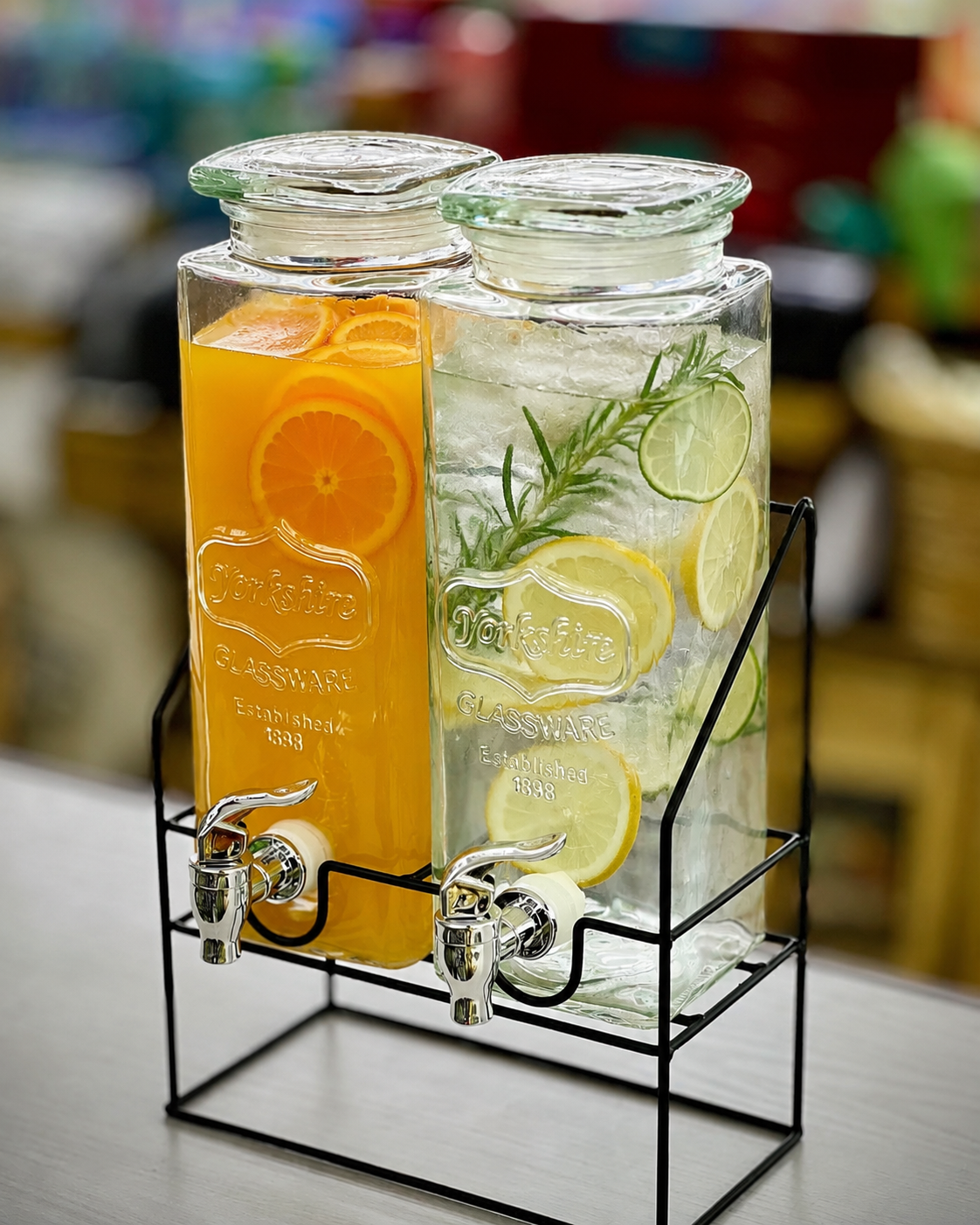 Glass beverage dispenser with dispensing tap, available in single 2.2L and double 2.2L configurations for serving cold drinks at home and events.