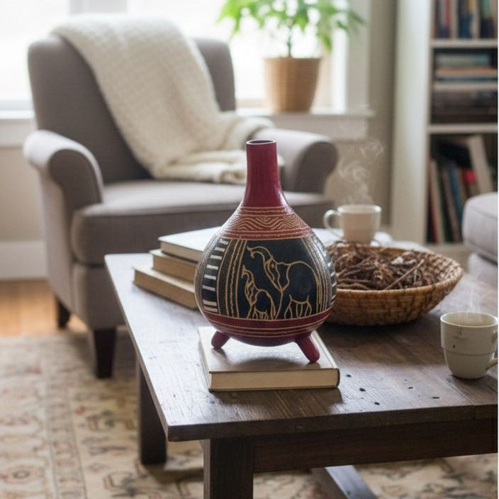 Handcrafted African calabash with red neck and stand, perfect for home décor or serving traditional drinks.