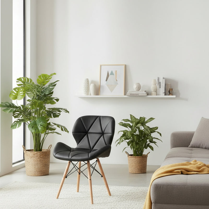 Black faux leather Eames-style dining chair with padded seat, geometric stitched backrest and beech wood legs, available in Nairobi, Kenya