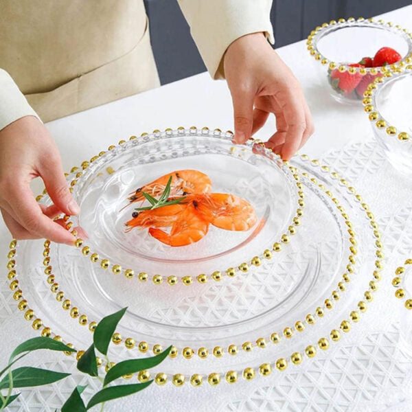 Clear glass plate with gold beaded rim available in 21cm, 27cm, and 32cm sizes for elegant table setting