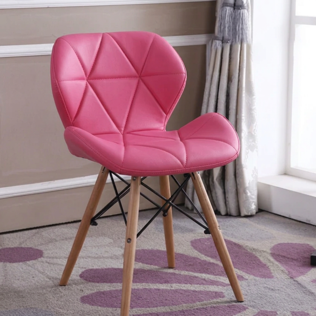 Pink faux leather Eames-style dining chair with padded seat, geometric stitched backrest and beech wood legs, available in Nairobi, Kenya