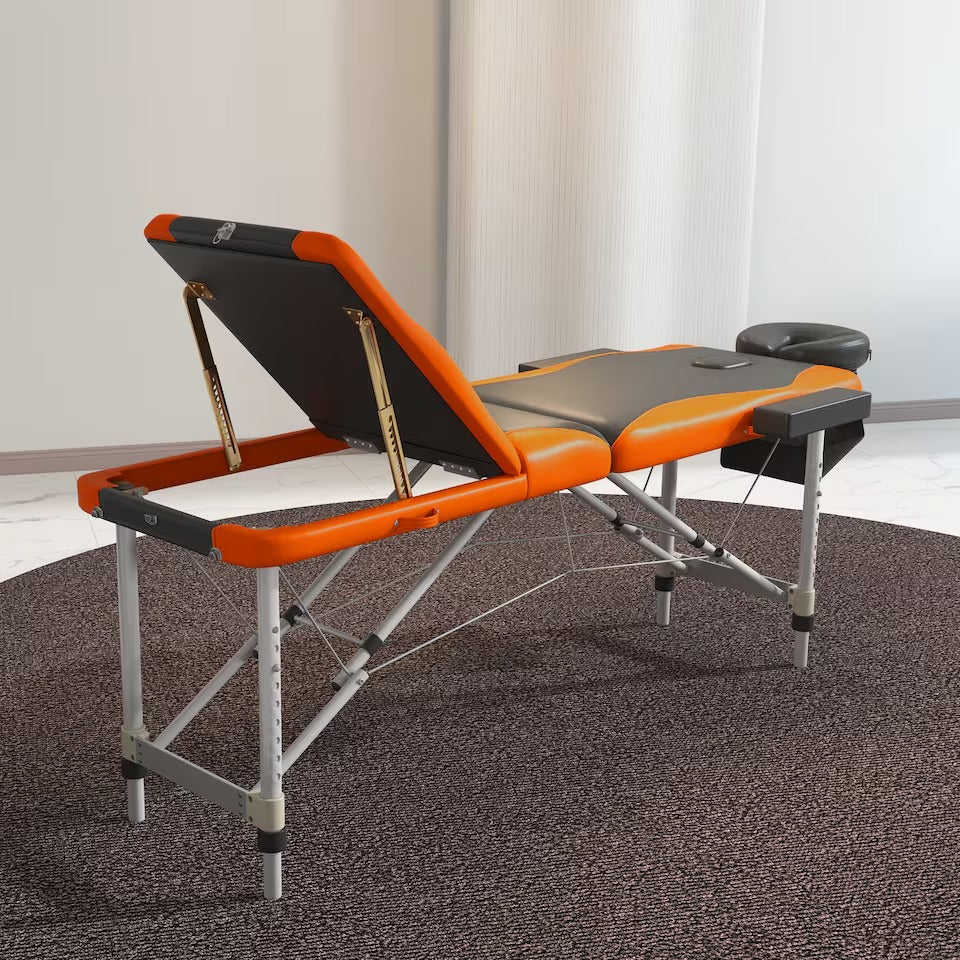 Portable black and orange massage table, 185 × 70cm, available in Nairobi, Kenya