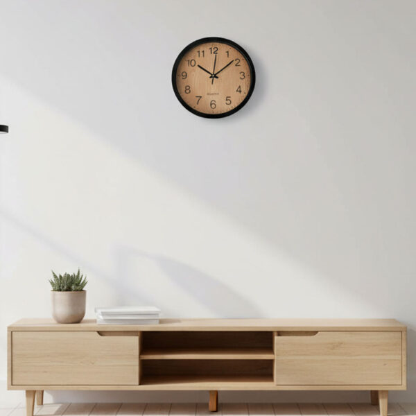 30cm black wall clock with light woodgrain face, bold black numerals, silent quartz movement, modern minimalist design, Gemelli Collection