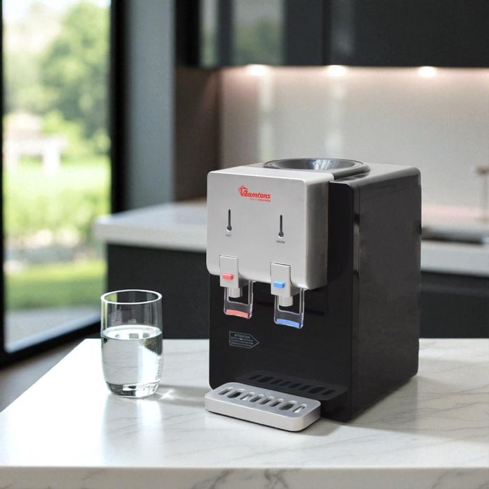 Black and silver table top water dispenser with hot and normal water functions and 550W heating power