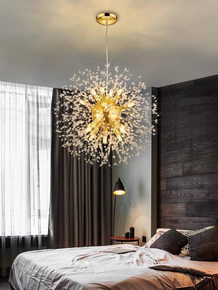 Gold dandelion crystal chandelier with radiating arms and sparkling K9 crystal buds creating a modern firework burst lighting effect.