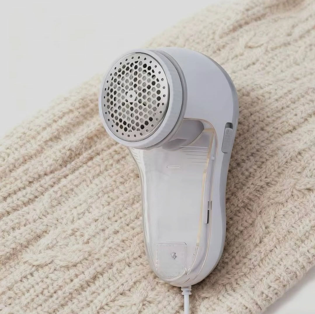 Rechargeable fabric lint remover with cordless design for removing lint, fuzz, and fabric pills from clothes, sweaters, blankets, and upholstery