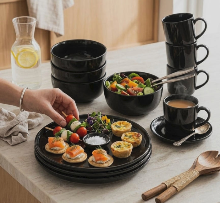 Gemelli Collections 18 piece black dinner set with 6 cups, 6 bowls and 6 platters for everyday dining and entertaining.