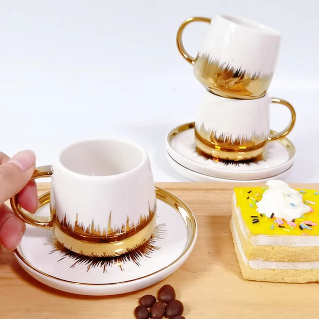 White cup with gold details
