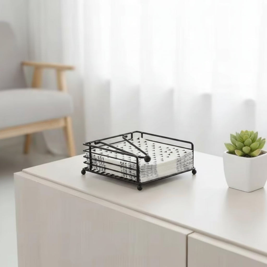 Metallic serviette holder available in gold and black.