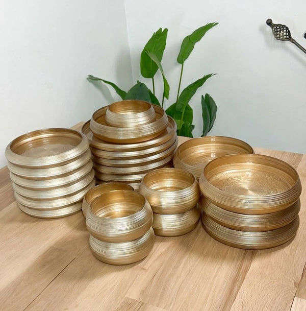 24-piece gold and brown brushed glass dinner set with glossy finish, including dinner plates, side plates, bowls and small soup bowls.