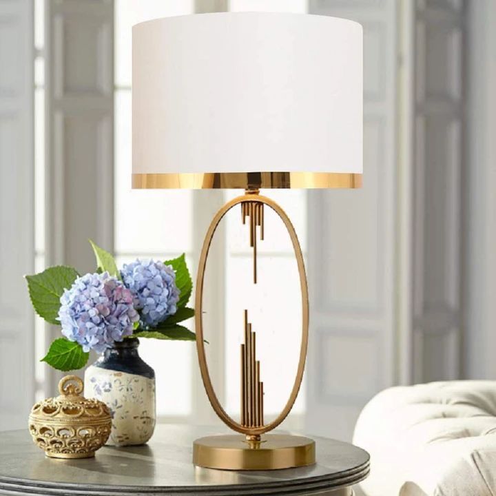 gold accent table lamp with sophisticated gold frame soft fabric shade and elegant metallic trim measuring 30 x 56 x 14 cm 