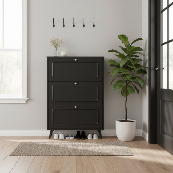 Black triple-layer flip shoe cabinet with golden accents storing multiple pairs of shoes