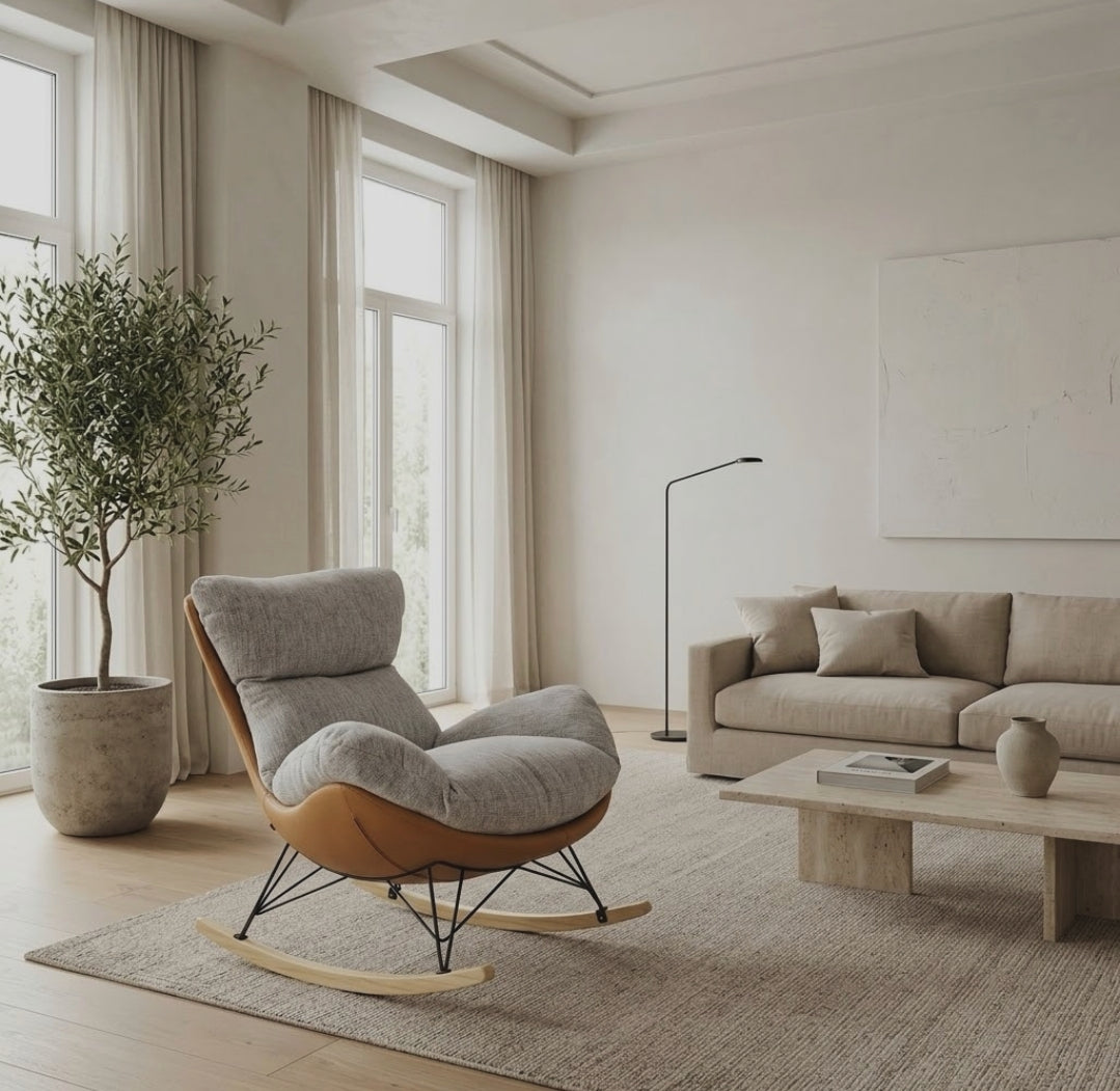 Gemelli Collections ergonomic rocking lazy sofa lounge chair with grey fabric cushioning, tan leather shell, black steel frame and wooden runners.