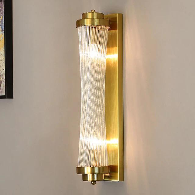 Twisted crystal tube wall sconce with brushed brass backplate and spiral glass rod cylinder modern luxury wall lighting for bedrooms and hallways