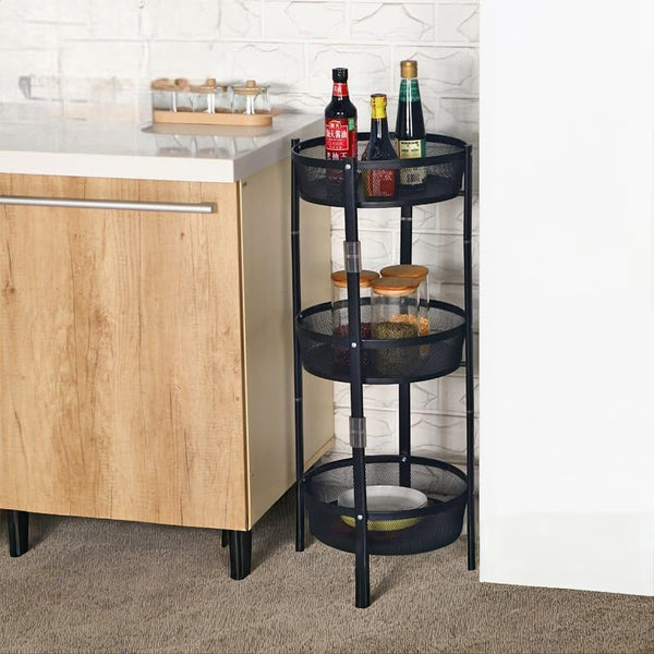 Foldable rotating metal fruit and vegetable rack with 360-degree access, multi-layer storage baskets and lockable wheels in white and black.