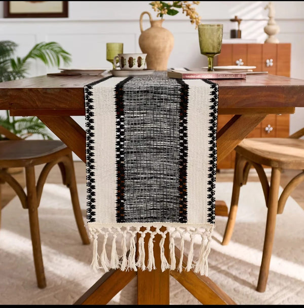 Boho cotton table runner with wide stripe design and knitted tassels for elegant home décor and dining table styling