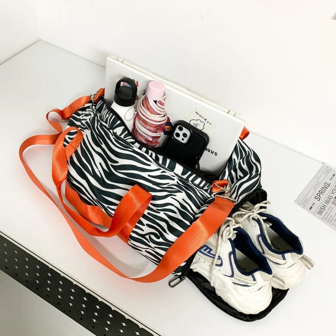 Multi-functional duffle bag with separate shoe and wet clothes compartments for gym, sports, travel, weekend trips, and overnight use