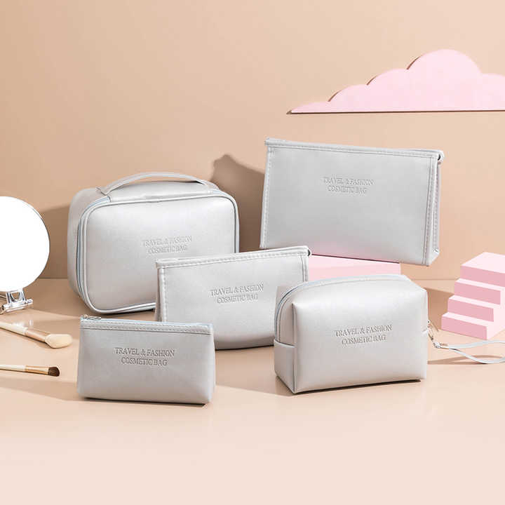 Set of 5 vegan leather travel makeup cosmetic bags in different sizes
