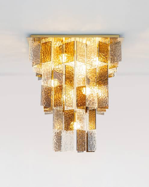 Amber and clear textured glass waterfall chandelier with tiered rectangular panels and gold frame semi-flush ceiling light.