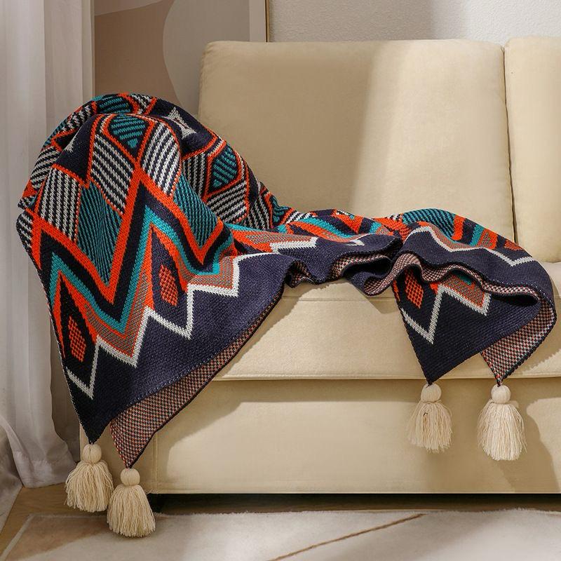 Nordic style bohemian knitted throw blanket with tassels 180x130cm for sofas beds armchairs and cosy home décor styling.