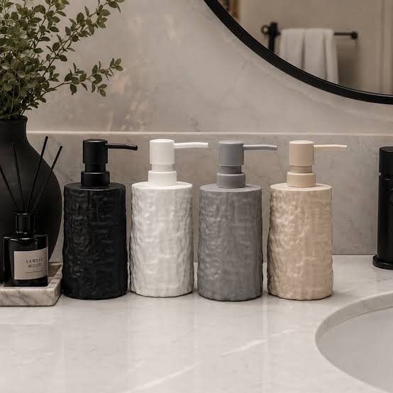 Stone textured soap dispenser with clean minimalist design available in grey beige black and white for bathroom and kitchen use