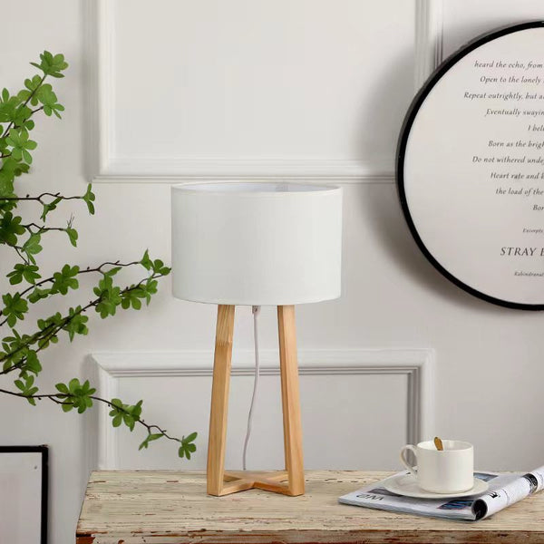 wooden tripod table lamp measuring 25x25x48cm with minimalist natural wood design providing warm ambient lighting