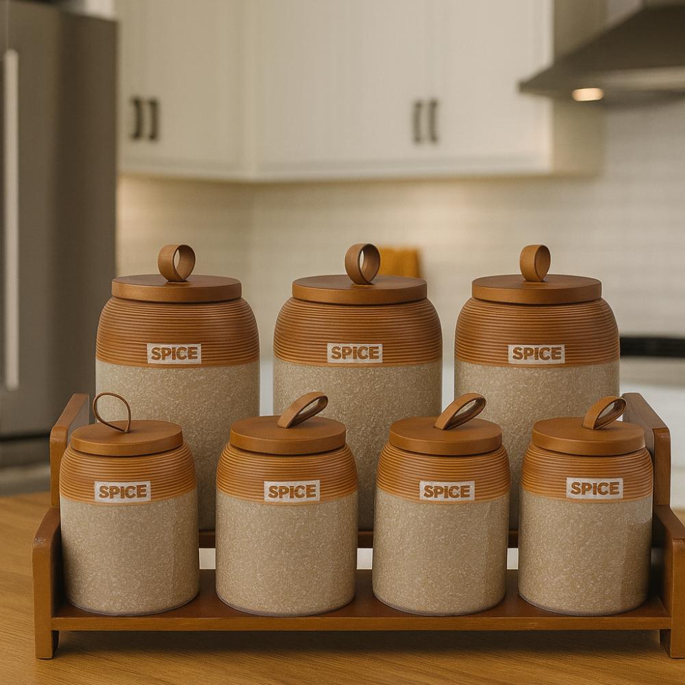 7 piece speckled ceramic spice jar set with wooden lids leather loop handles and wooden display tray for spices tea coffee sugar and pantry organisation.