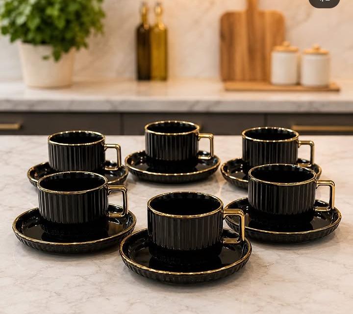 European-style ceramic coffee cup and saucer set with six ribbed 300ml mugs, gold-plated handles, and six matching saucers, available in black and white