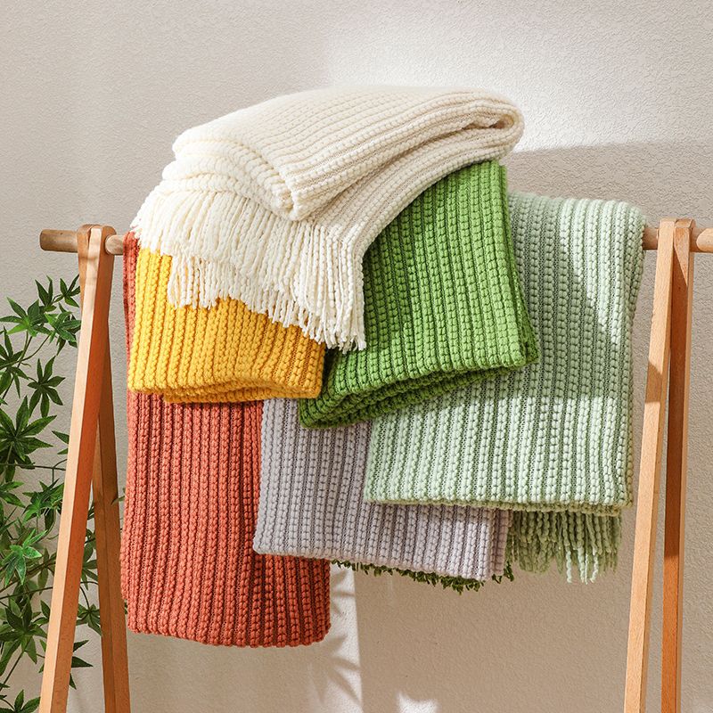 Knitted throw blanket measuring 130cm by 170cm in mustard white peach and brown for cosy home comfort and decorative styling.