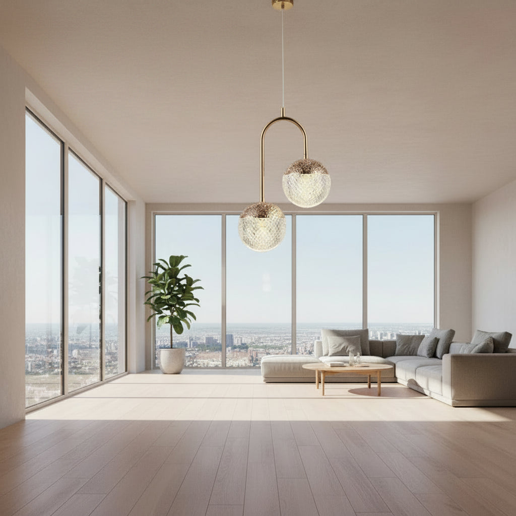 Gemelli Collections double globe pendant light with textured crystal glass globes, gold arch frame, and modern staggered ceiling design for luxury dining rooms and contemporary interiors.