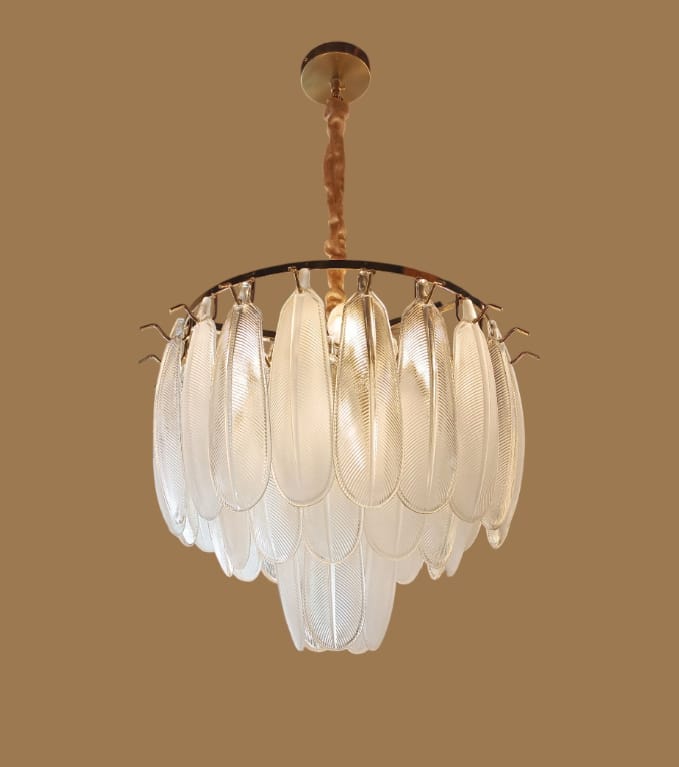 glass feather chandelier with layered frosted leaf-shaped panels creating a cascading waterfall effect with warm ambient lighting.