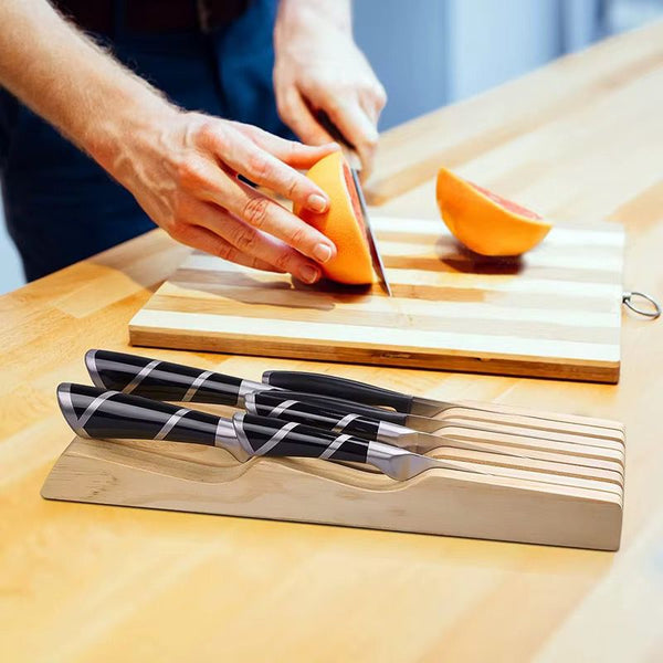 Wooden kitchen knife holder for securely organising and storing kitchen knives while helping protect blades and keep countertops neat and clutter-free.