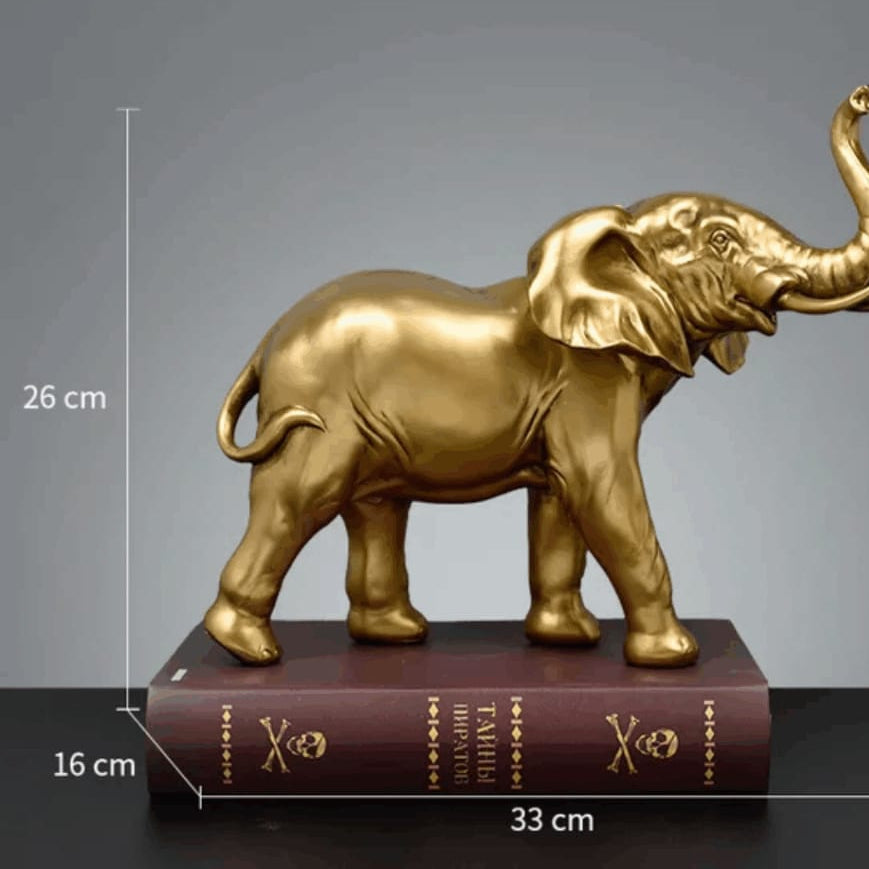 Gemelli Collections mirror gold elephant figurine with raised trunk, detailed body and tusks, measuring 33cm long and 26cm high for luxury home and office décor