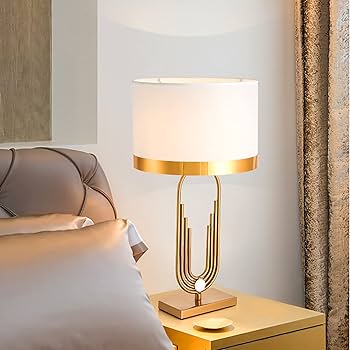 gold accent table lamp with sophisticated gold frame soft fabric shade and elegant metallic trim measuring 30 x 56 x 14 cm