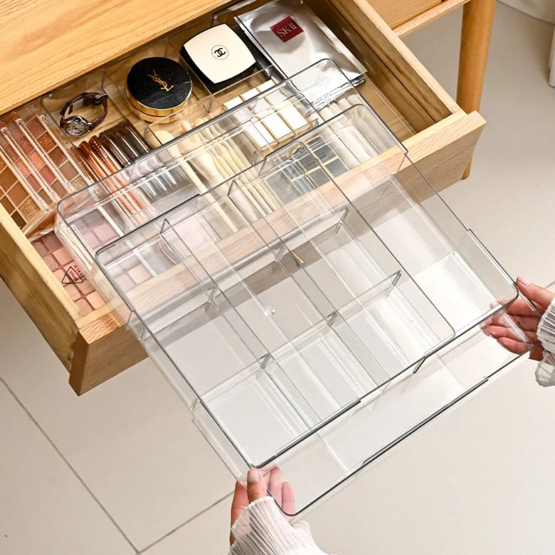 Acrylic expandable drawer organiser adjustable on all four sides for flexible and organised drawer storage.