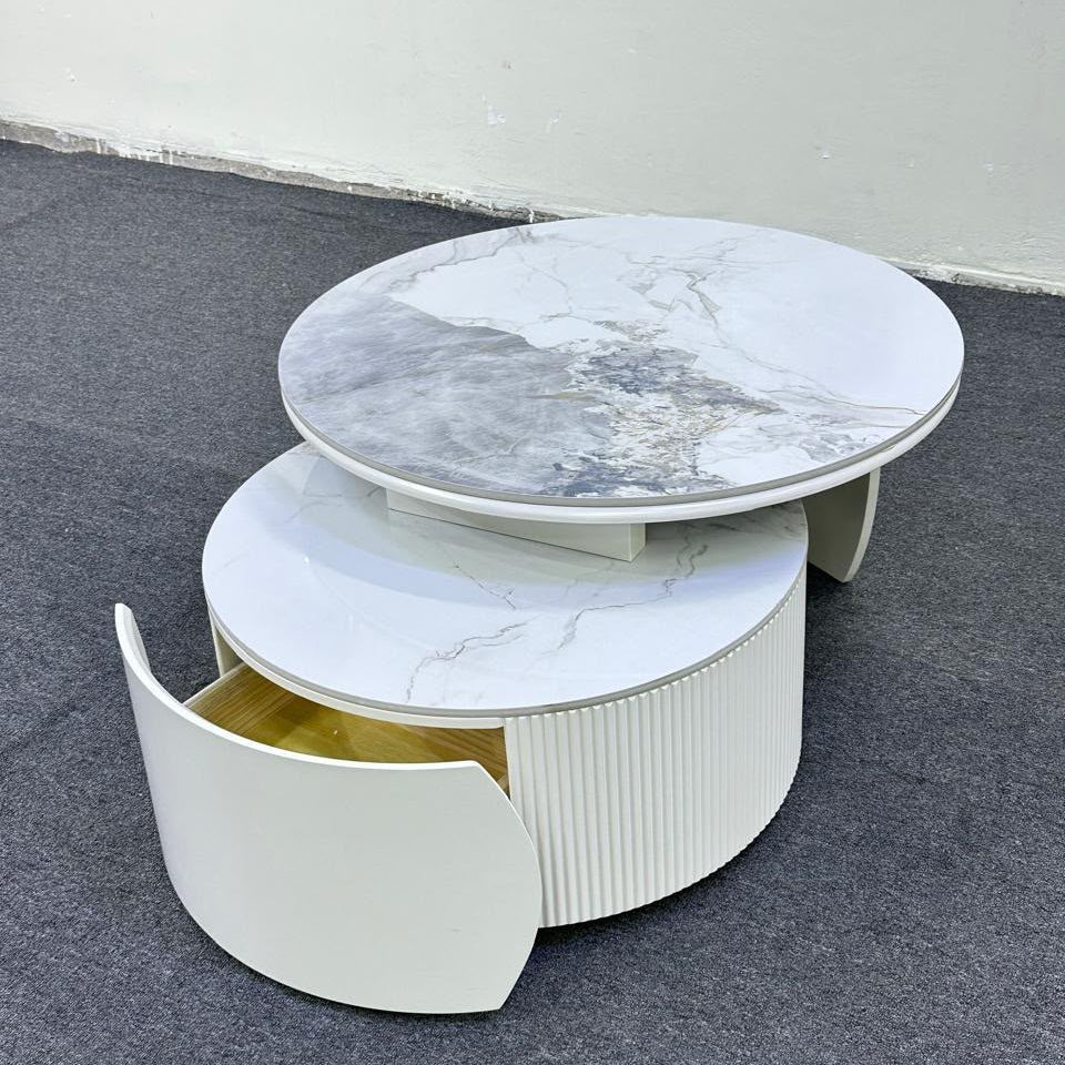 Gemelli Collections 2-piece rotating nesting coffee table set with marble top, fluted MDF base, curved storage drawer, and 360-degree rotating design for modern living room décor.