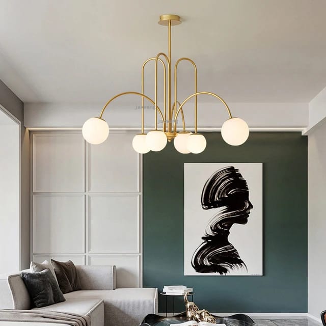 Brass arch chandelier with asymmetrical arms and opal glass globe shades modern bubble ceiling light for living room and dining interiors