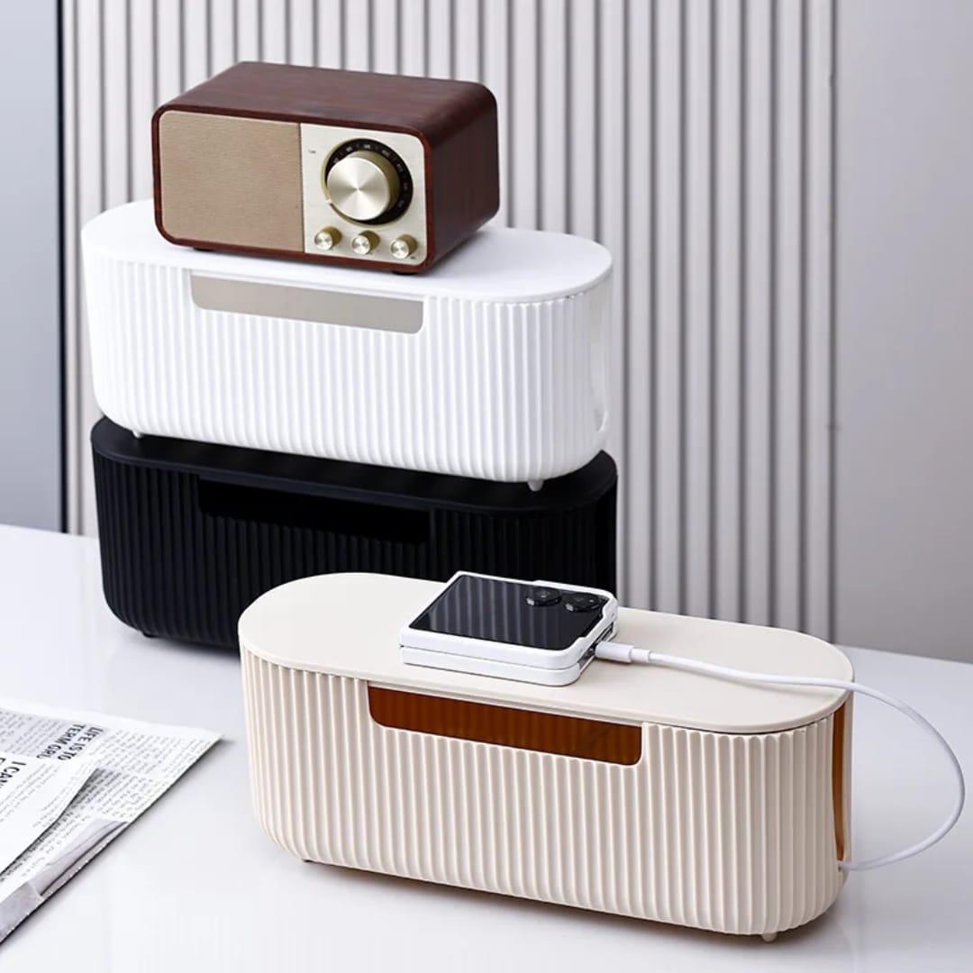 Cable storage box for organising chargers extension cords power strips and cables in home and office spaces.