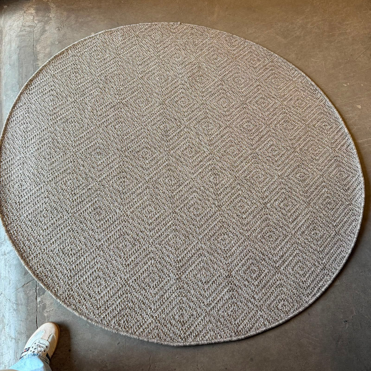 
Oriental Weavers Oria round herringbone flat weave rug in beige and taupe polypropylene with textured woven design.