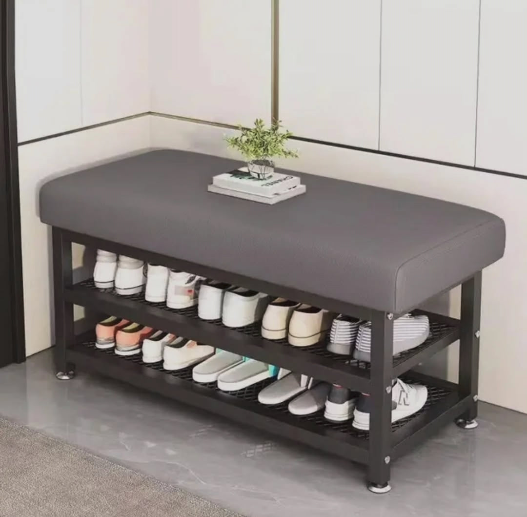 Entryway shoe rack with padded seat and two tier shoe storage featuring a strong metal frame in grey measuring 100x32x51cm.