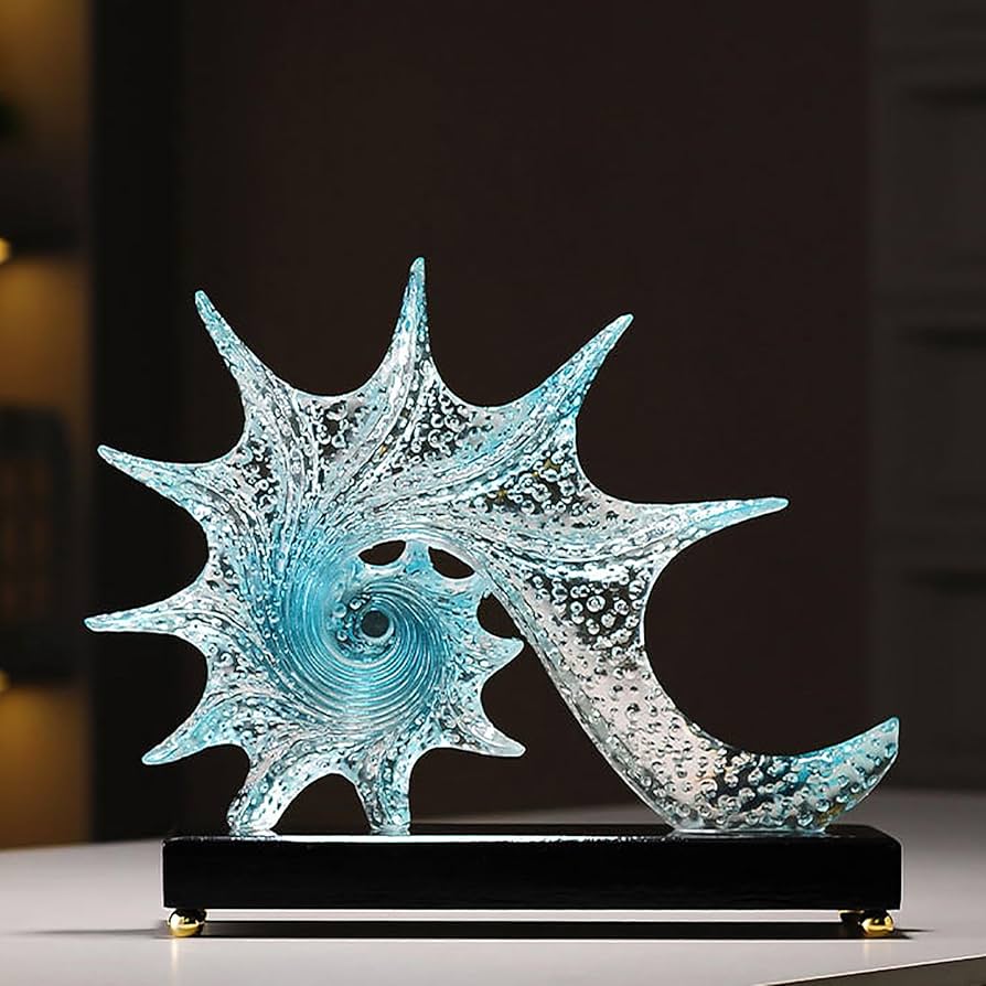 Gemelli Collections blue resin conch sculpture with starfish-inspired design, sparkling bubble texture, ocean blue gradient centre, and glossy black display base.