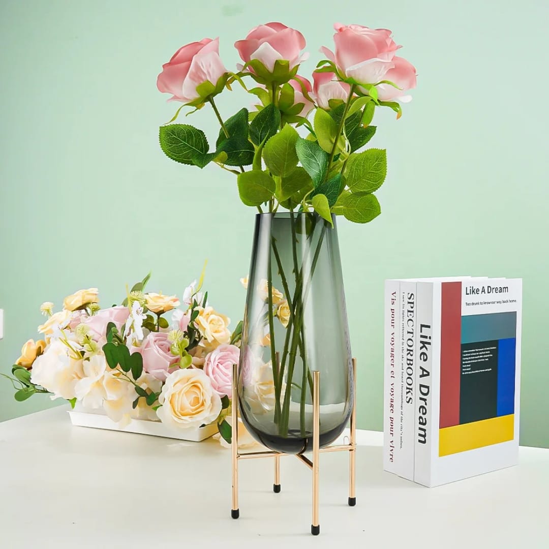 Creative glass vase with metallic stand featuring modern decorative design for floral arrangements and tabletop home décor.