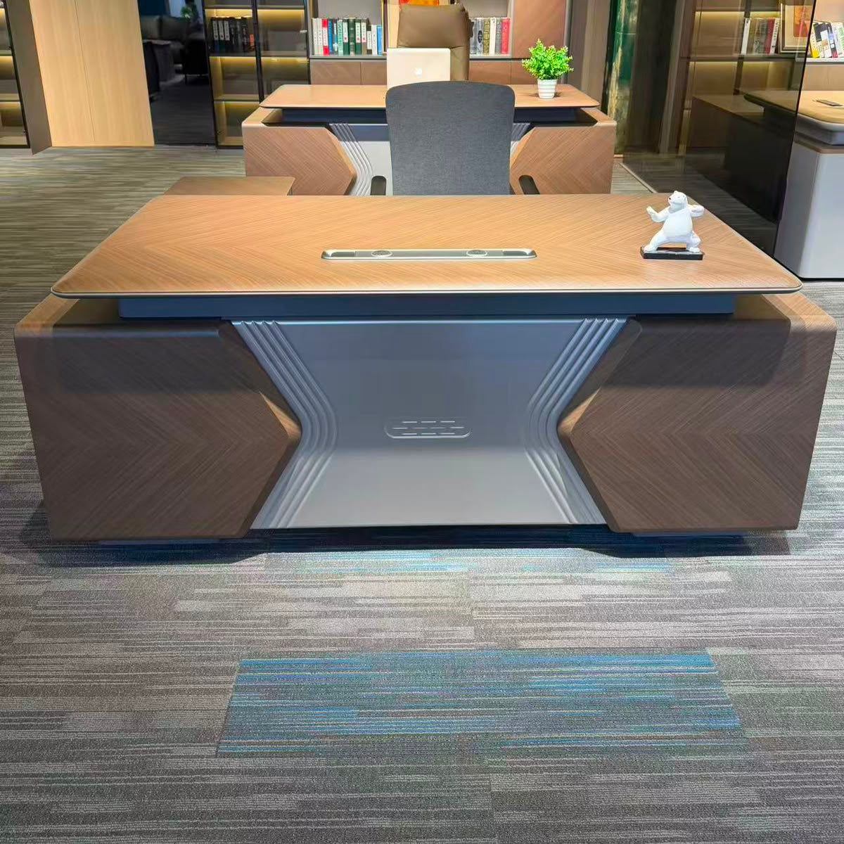 Gemelli Collection 2 metre executive office desk with chevron oak finish, silver geometric front panel and integrated power port