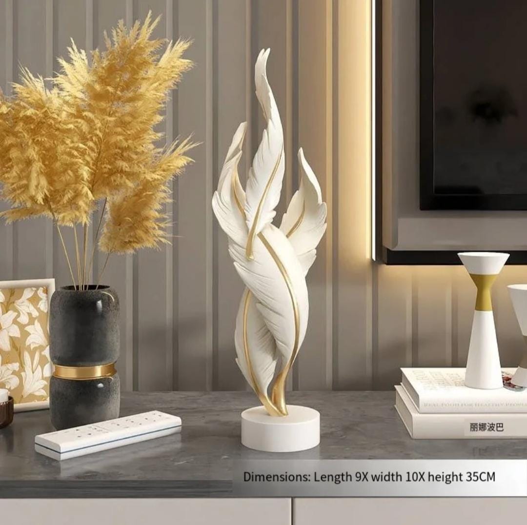 Gemelli Collections white and gold twisted feather resin sculpture with round base for tabletop and console decor